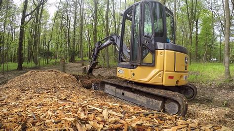 digging out stumps with mini excavator|mini excavator stump removal.